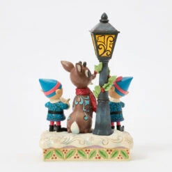 Enesco Jim Shore Rudolph And Elves Caroling Light-Up Figurine, 8.4" 9 Enesco Jim Shore Rudolph And Elves Caroling Light-Up Figurine, 8.4" -Enesco Store Rudolph the RedNosed Reindeer LightUp Figurine 6017191 03