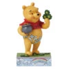 Enesco Jim Shore Disney Winnie The Pooh With Clover Figurine, 4.5" 2 Enesco Jim Shore Disney Winnie The Pooh With Clover Figurine, 4.5" -Enesco Store Winnie the Pooh With Pot of Gold Figurine 6016335 01